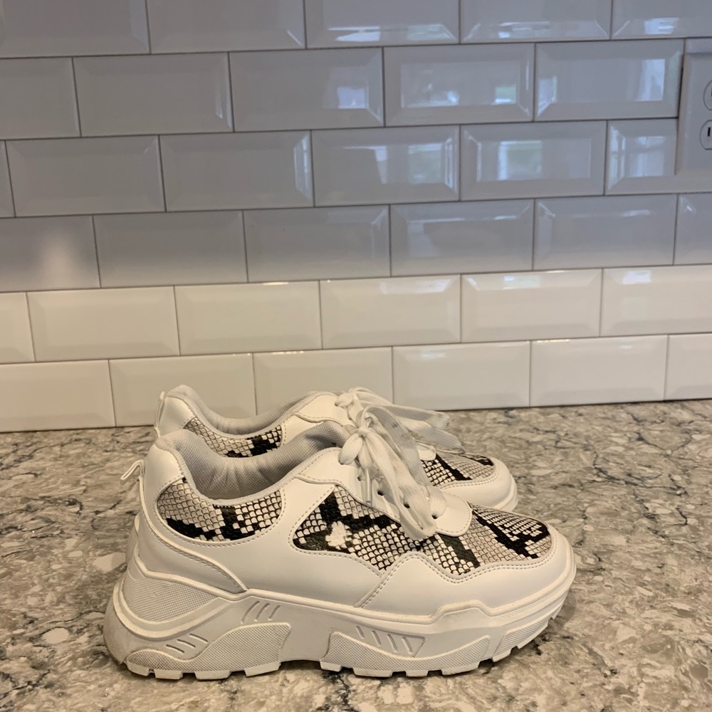 Snakeskin sneakers .